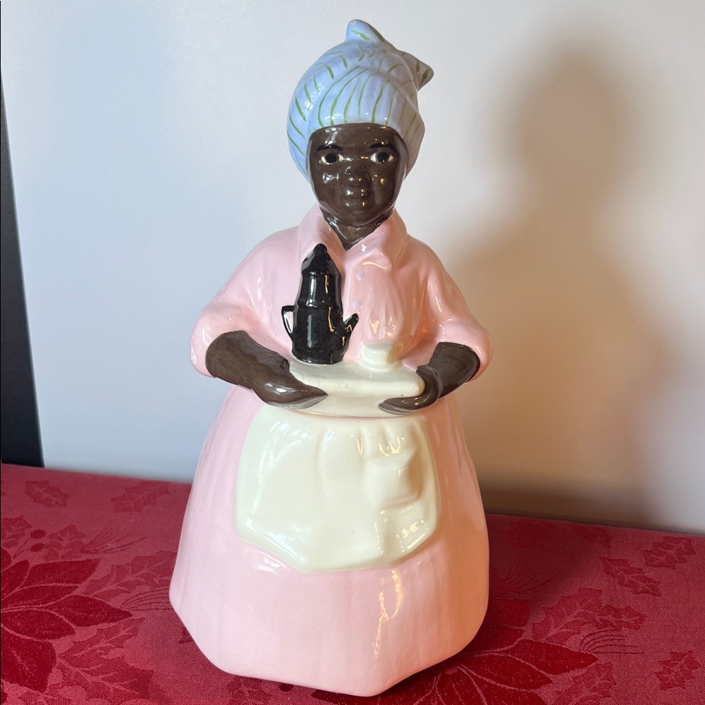 Pink Lady Ceramic Cookie Jar with Cream Apron and Headscarf.